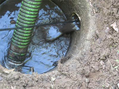 Photo of septic lines being cleaned by hydro jetting, a low-pressure procedure that is part of septic services offered by Statewide Environmental Services LLC