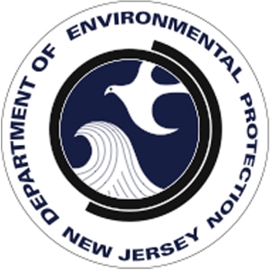 The NJ State Department of Environmental Protection seal; dark blue lettering surrounding drawing depicting water and a bird in a circle.