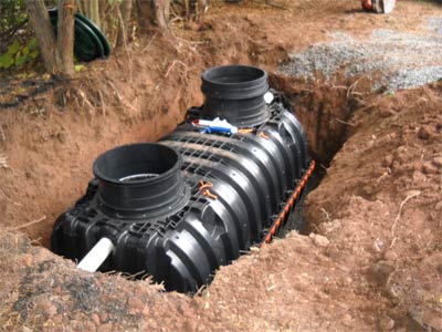 Photo of new plastic holding tank installed as part of Statewide Environmental's septic system repair and septic parts replacement services