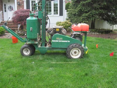 Photo of a Terralift machine on front lawn of a home; the Terralift aeration process is one of the procedures used in septic field restoration