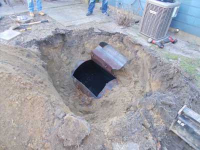 Photo of underground oil tank; Statewide Environmental Services' residential environmental services includes the removal or abandonment of underground storage tanks.