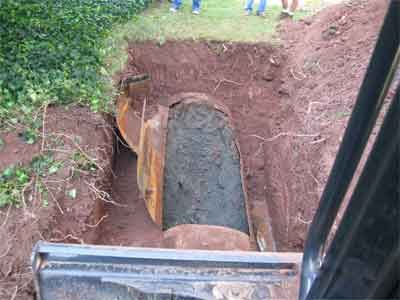 Photo of uncovered decommissioned oil tank illustrates the proper method to use in oil tank abandonments.