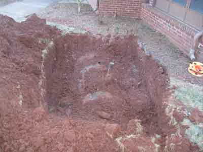 Photo of an unearthed underground fuel storage tank (UST) in preparation for removal by Statewide Environmental Services LLC.