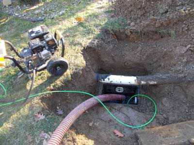 Photo of low-pressure hydro jetting equipment used to clear the clogs in a residential septic system.
